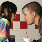 Kyle Gallner and Emily Skeggs in a cropped poster for the coming of age drama Dinner In America